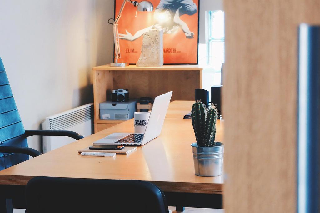 Anna working at her organized home office with morning routine checklist